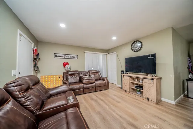 a bathroom with a toilet a sink and a large mirror