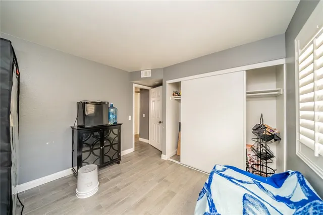 a bedroom with furniture and a window