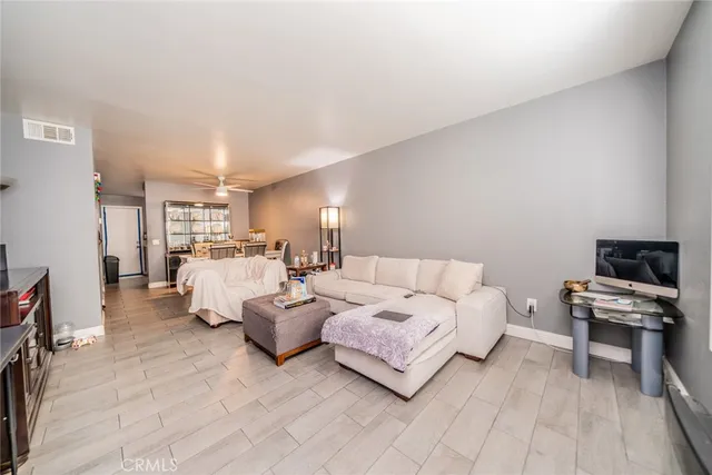 a bed room with a bed window and a couch