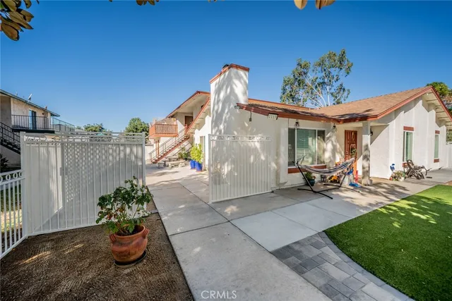 an aerial view of a houses and a mountain view