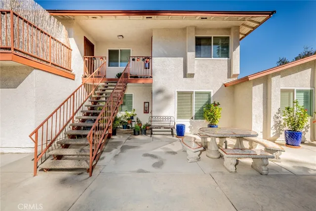 an aerial view of residential houses with outdoor space