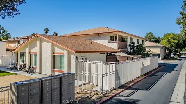 a front view of a house with large windows