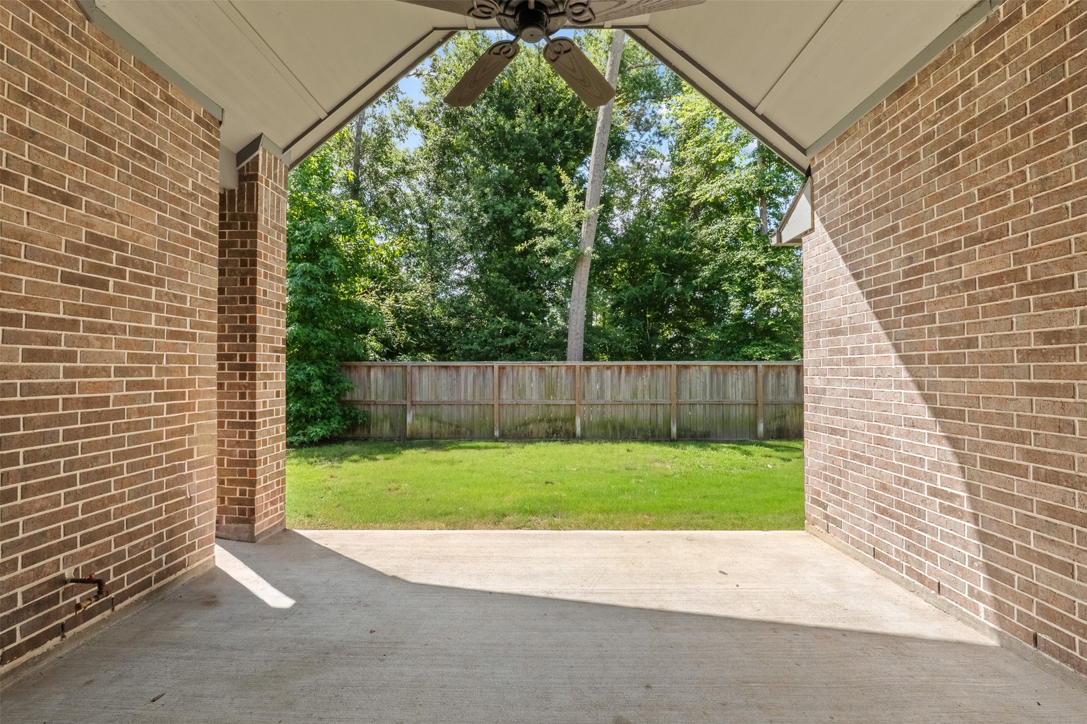 8022 McKittrick Ridge Drive Porter, TX 77365 - Photo 32 of 44 Back patio - Grass virtually staged for growth potential