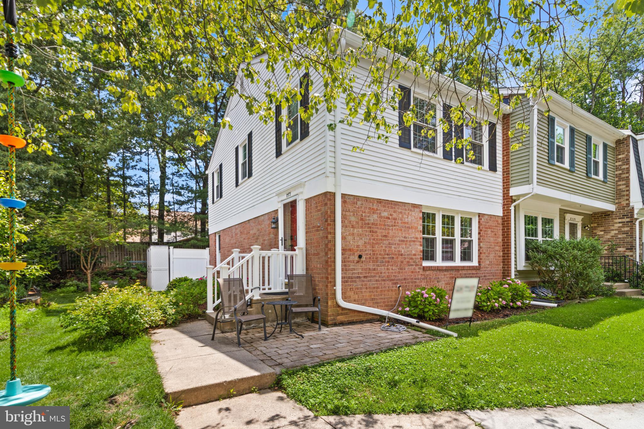 8573 Tyrolean Way Springfield, VA 22153 - Photo 1 of 32 a front view of a house with garden and trees