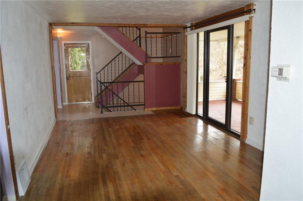 9080 Highland Road Pittsburgh, PA 15237 - Photo 6 of 25 Living room with slider to porch