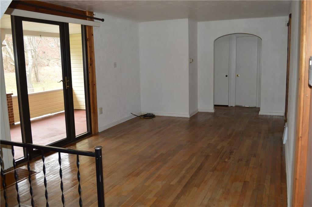 9080 Highland Road Pittsburgh, PA 15237 - Photo 7 of 25 Living room with slider to porch
