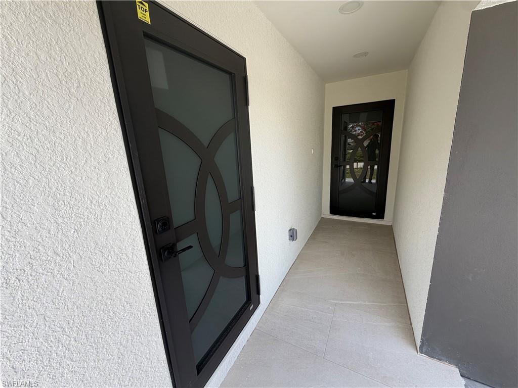 15 Louisiana Road Lehigh Acres, FL 33936 - Photo 10 of 22 a view of hallway with window