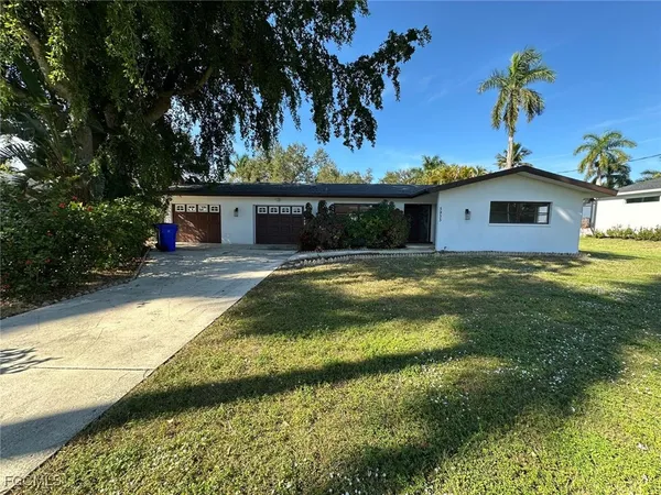 a view of swimming pool with a yard