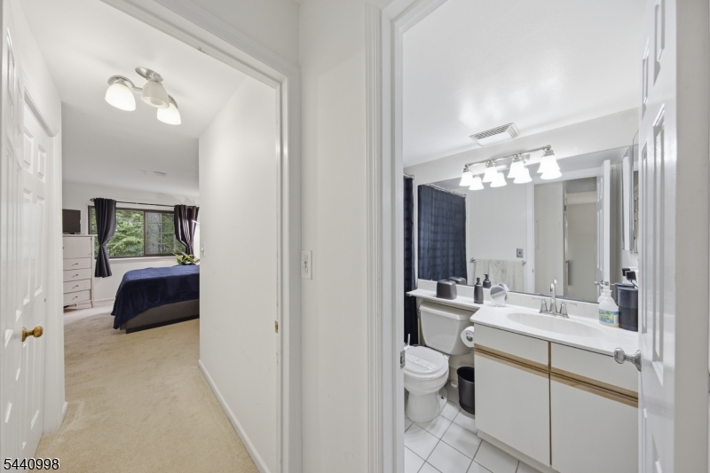 609 Mark Twain Way Mahwah, NJ 07430 - Photo 15 of 40 a bathroom with a double vanity sink mirror and toilet