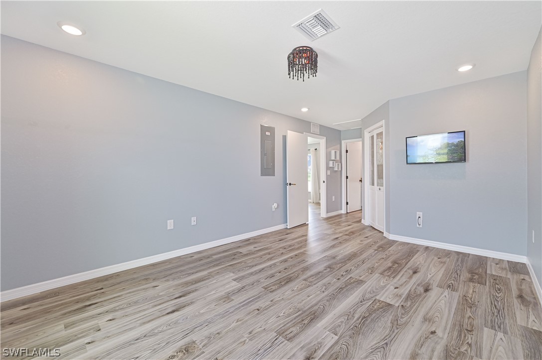 7085 Brazil Circle LaBelle, FL 33935 - Photo 22 of 32 a view of an empty room with wooden floor