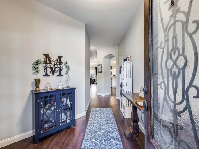 a hallway with wooden floor