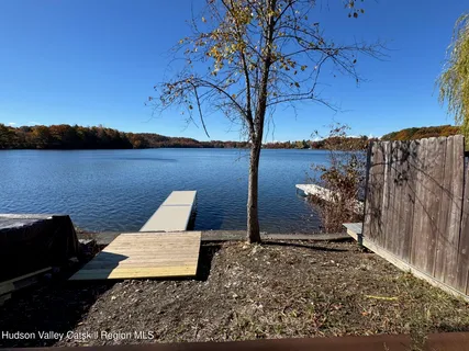 a view of a lake in middle of a town