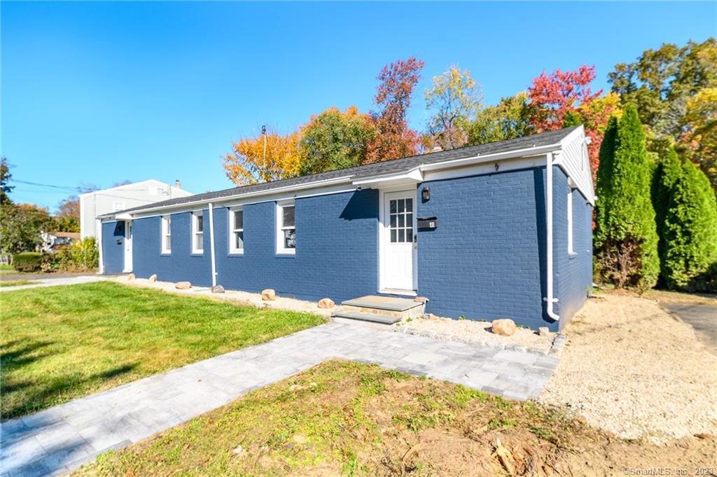 a front view of a house with a yard