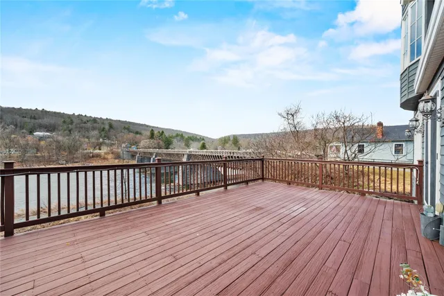 a view of a balcony with wooden floor