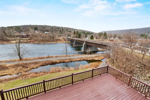 a view of a balcony with wooden floor