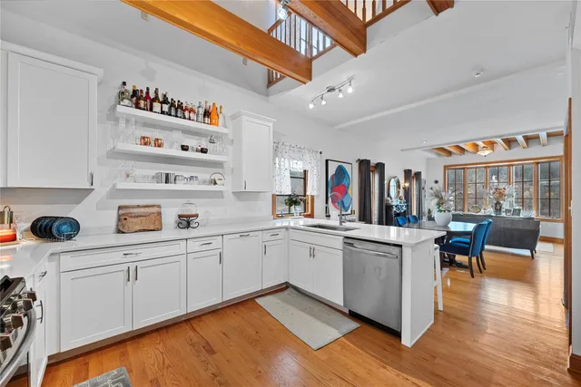 a open kitchen with stainless steel appliances granite countertop a sink and cabinets