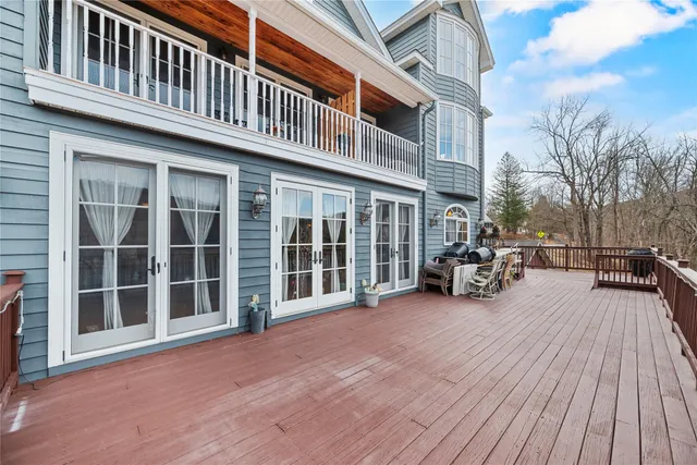 a view of a house with a large window and wooden floor