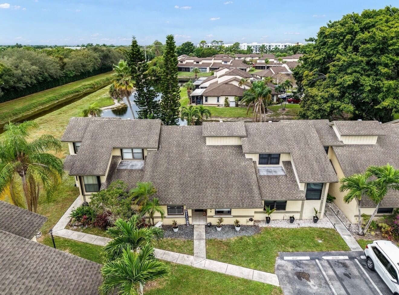9358 Ketay Circle Boca Raton, FL 33428 - Photo 27 of 28 an aerial view of a house with garden space and lake view