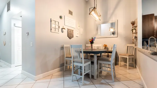 a kitchen with stainless steel appliances a refrigerator and a stove top oven