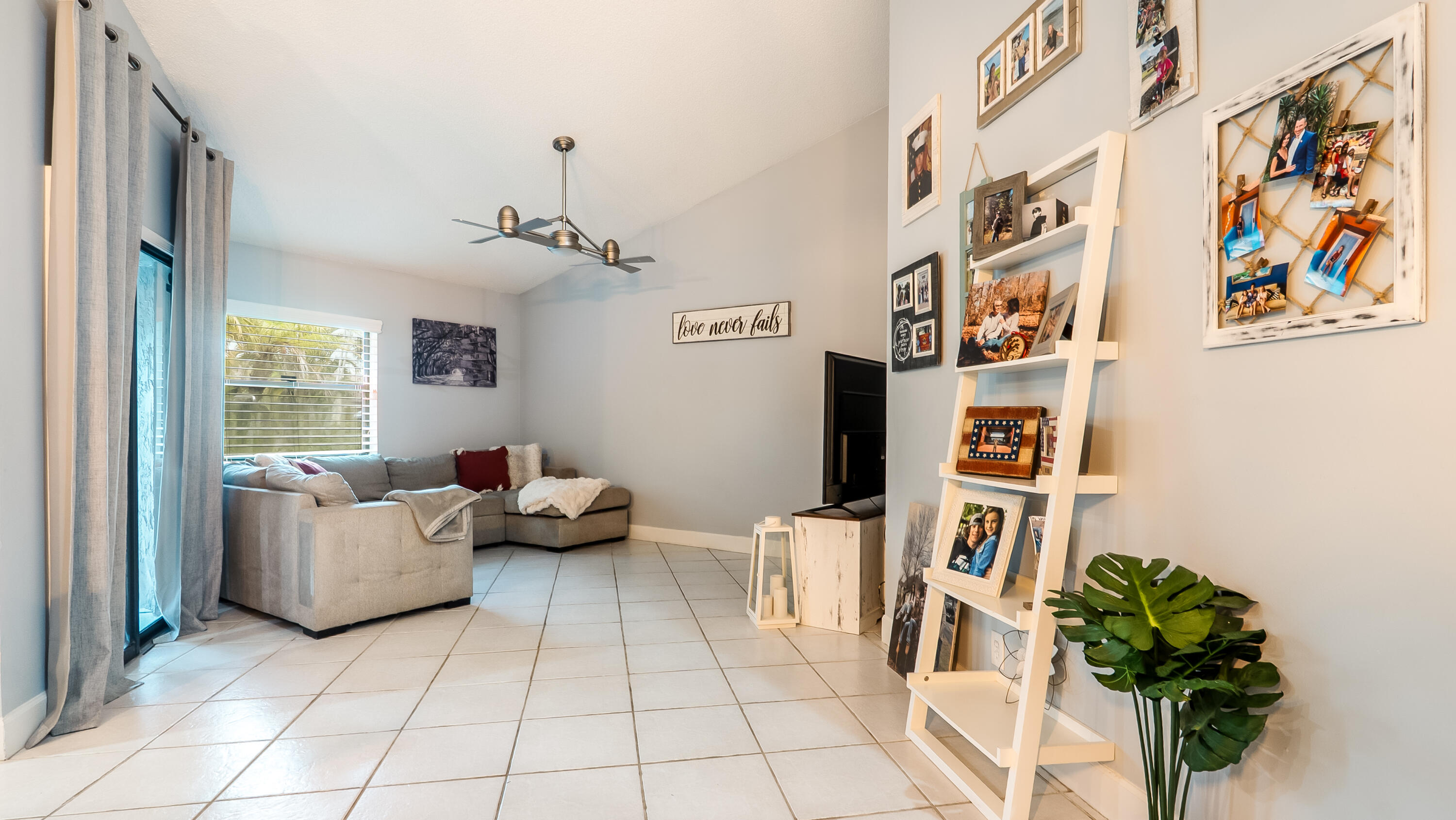 9358 Ketay Circle Boca Raton, FL 33428 - Photo 9 of 28 a living room with furniture and a potted plant