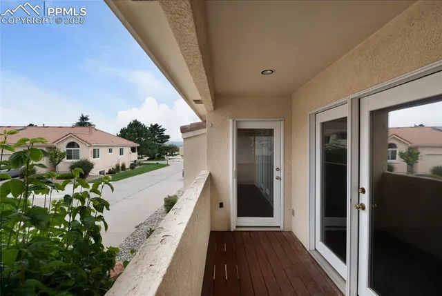 a view of a porch with a floor to ceiling window