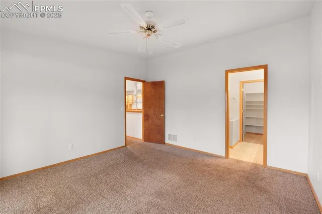 a view of an empty room and a window