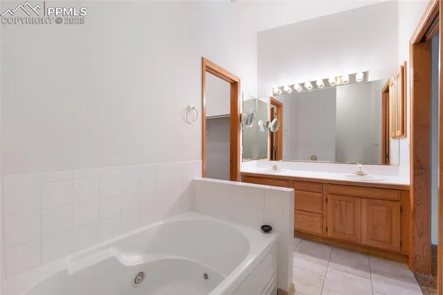 a bathroom with a bathtub and a sink
