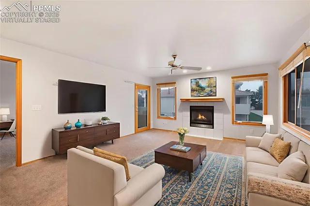 a living room with furniture and a flat screen tv