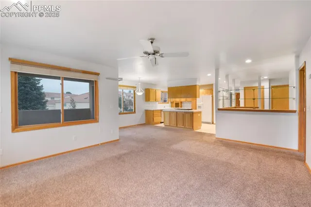 a view of a kitchen with a sink and a window
