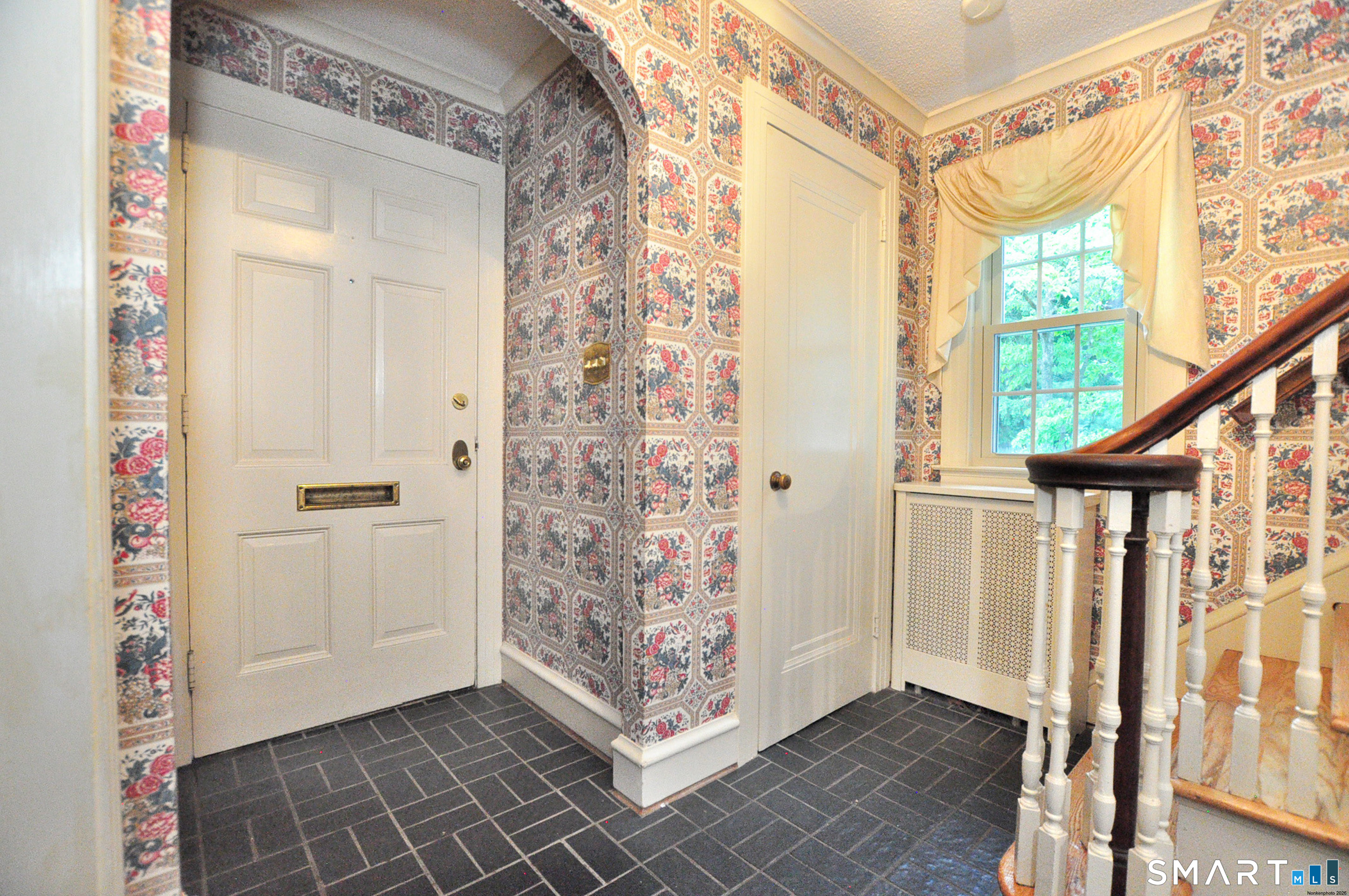 10 Harvey Road Windsor, CT 06095 - Photo 15 of 36 a view of an entryway with wooden floor and door