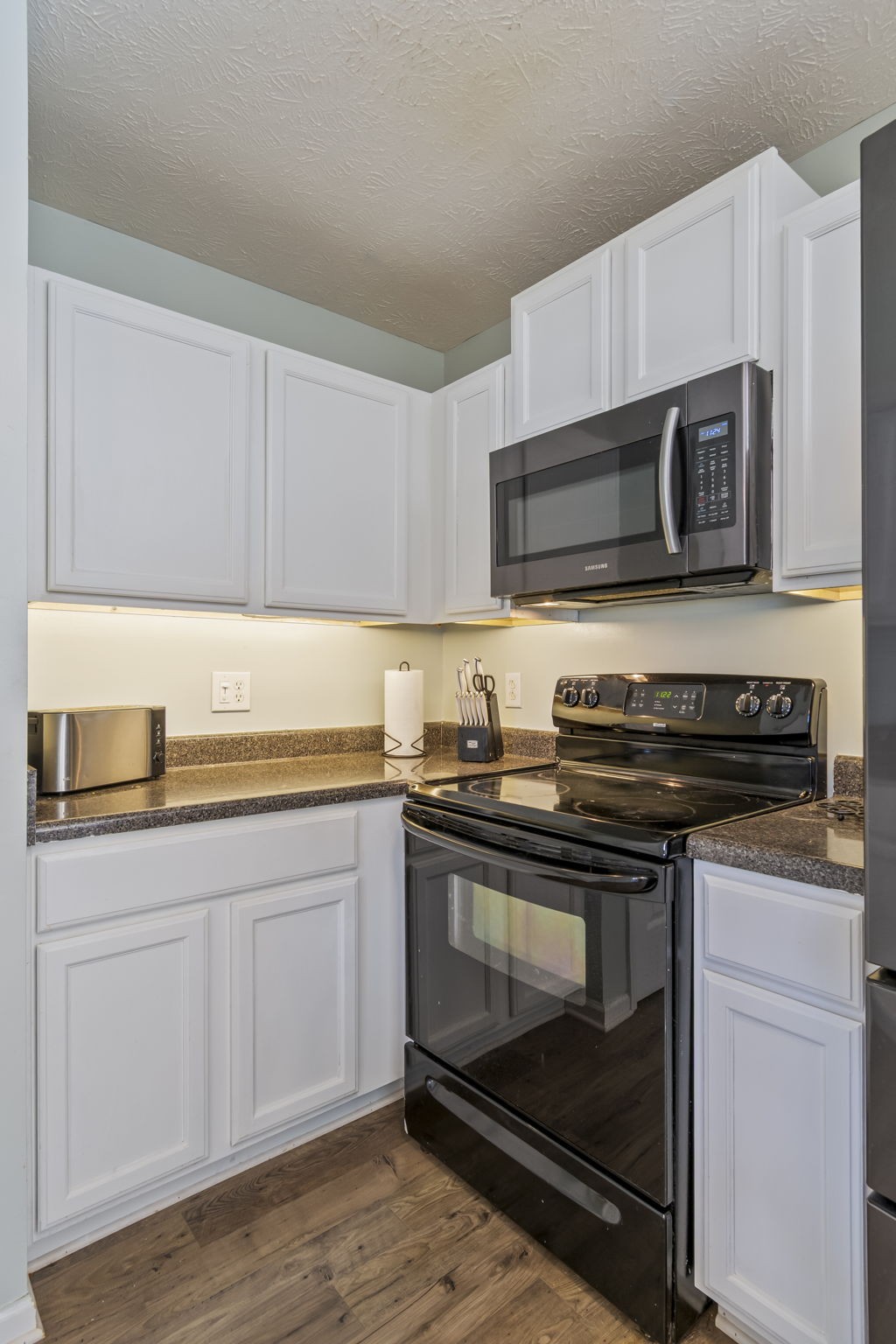 3317 Cornerstone Drive Murfreesboro, TN 37128 - Photo 14 of 33 a kitchen with granite countertop a stove microwave and sink
