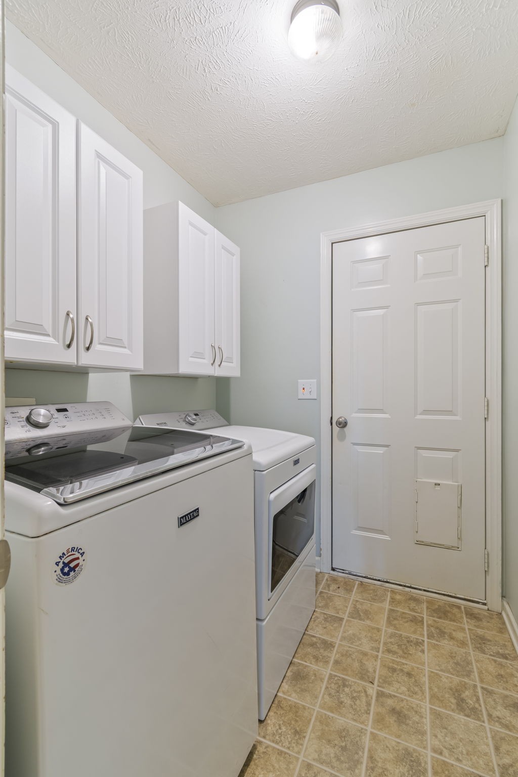 3317 Cornerstone Drive Murfreesboro, TN 37128 - Photo 18 of 33 a view of washer and dryer with kitchen in the background
