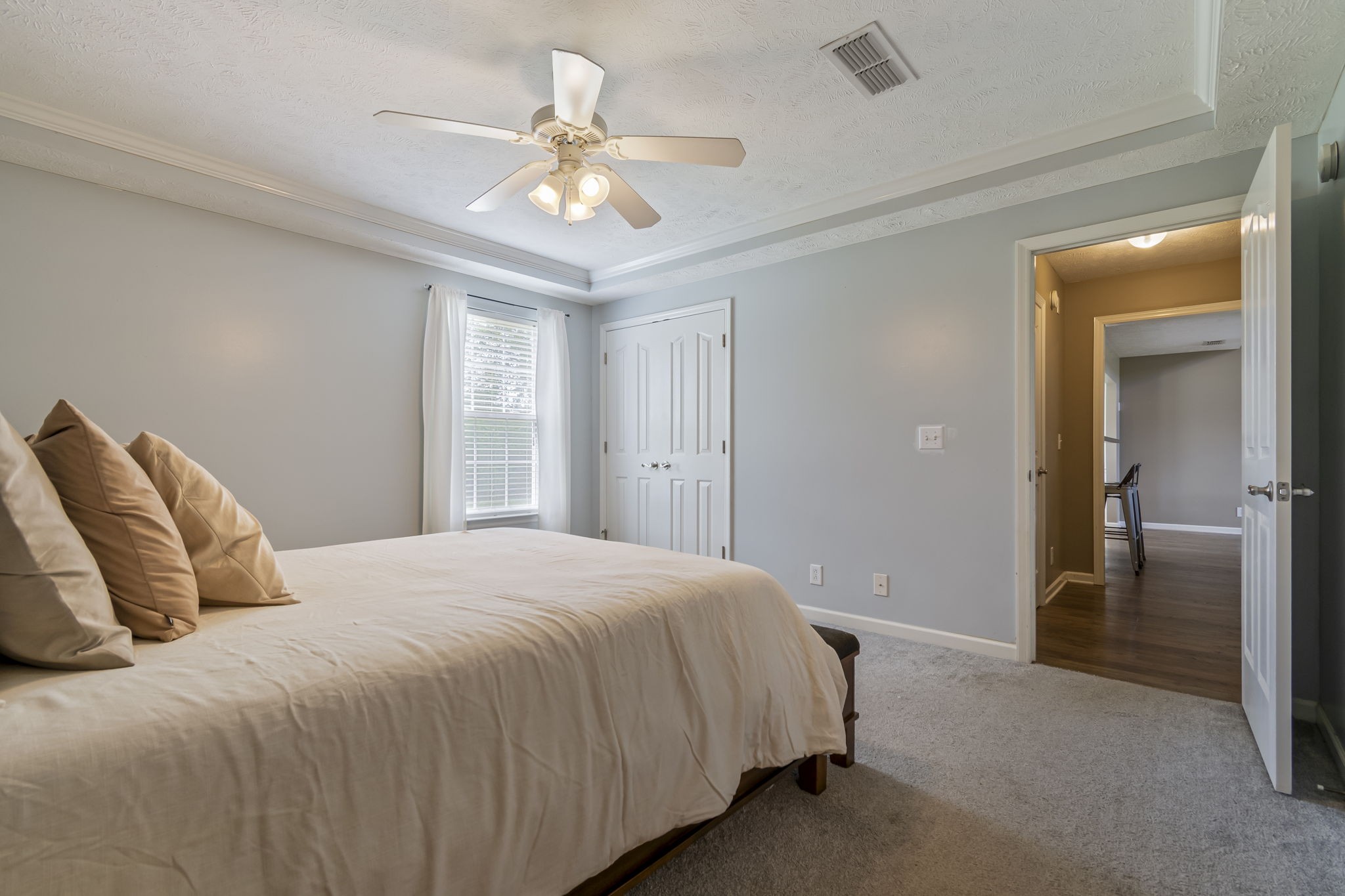 3317 Cornerstone Drive Murfreesboro, TN 37128 - Photo 20 of 33 a bedroom with a bed and a chandelier