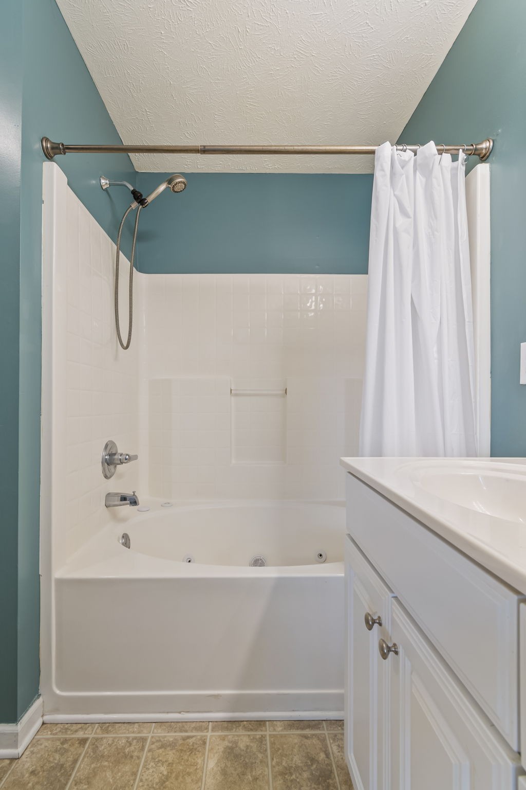 3317 Cornerstone Drive Murfreesboro, TN 37128 - Photo 22 of 33 a bathroom with a shower and a bath tub