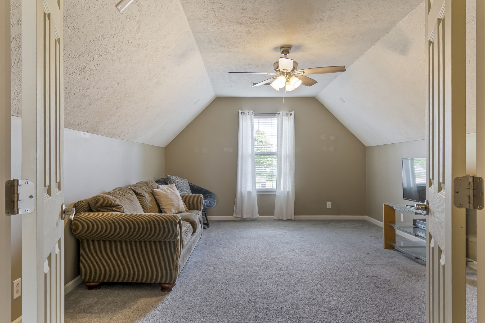 3317 Cornerstone Drive Murfreesboro, TN 37128 - Photo 29 of 33 a living room with furniture and a chandelier
