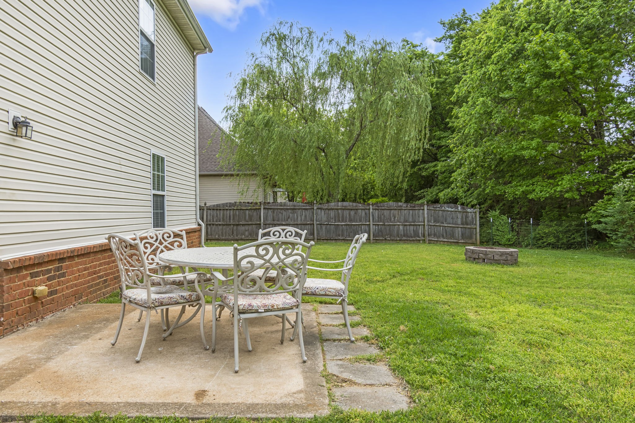 3317 Cornerstone Drive Murfreesboro, TN 37128 - Photo 30 of 33 a view of a chair and table in the backyard