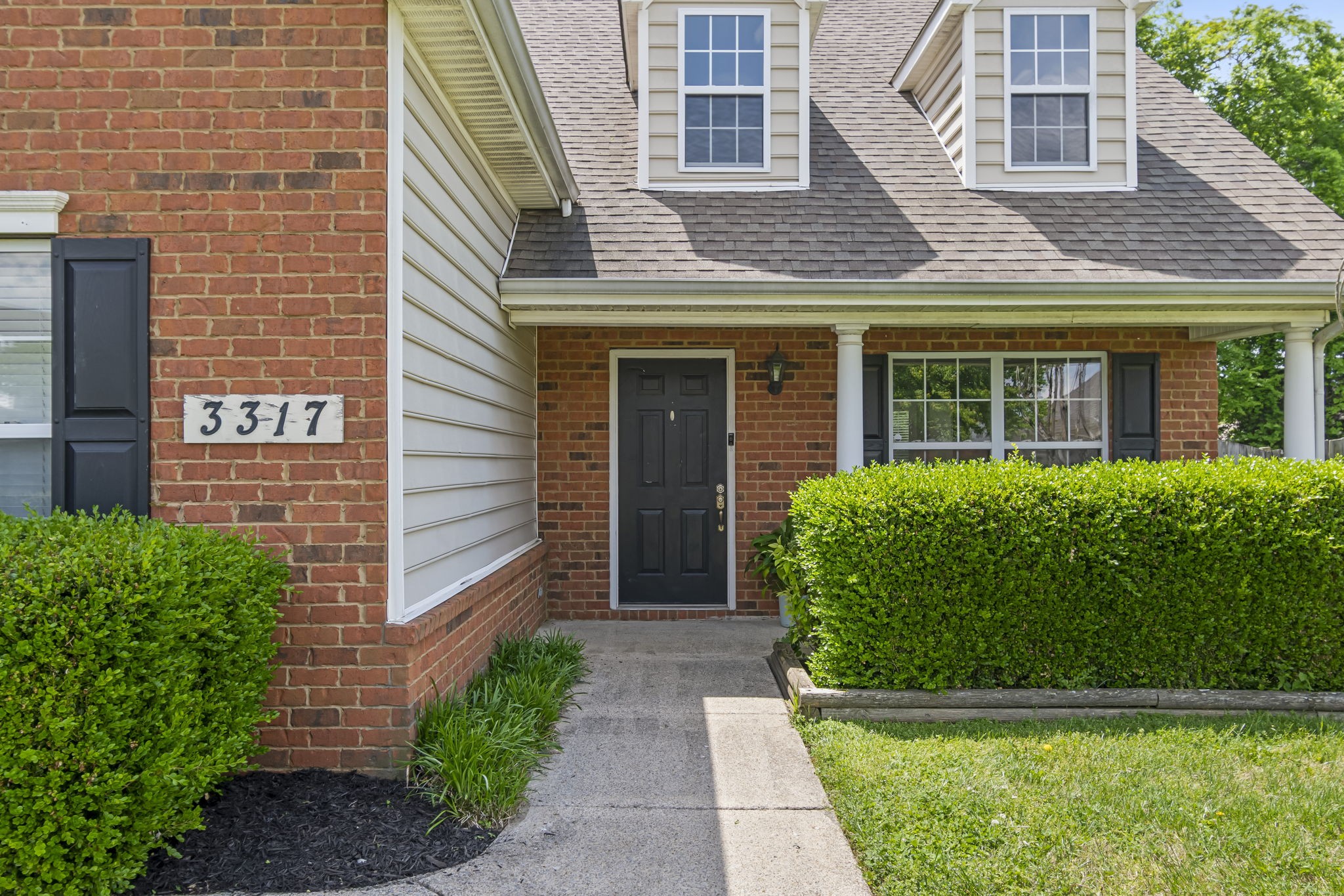 3317 Cornerstone Drive Murfreesboro, TN 37128 - Photo 3 of 33 a front view of a house with garden