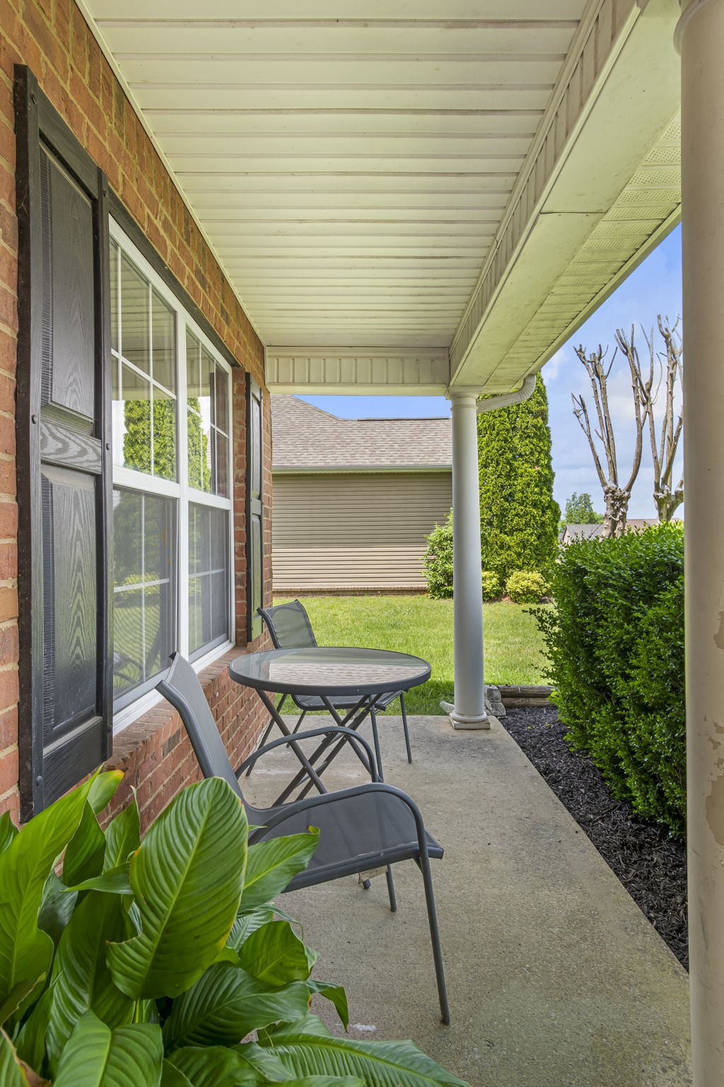 3317 Cornerstone Drive Murfreesboro, TN 37128 - Photo 5 of 33 a roof deck with table and chairs and potted plants