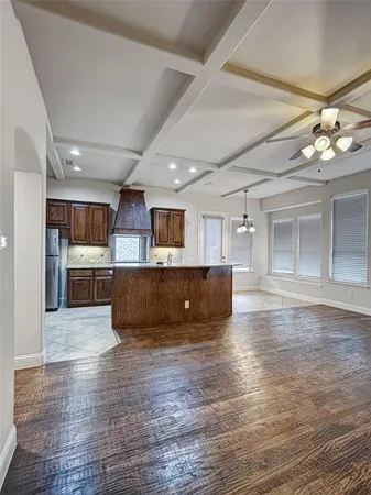 a view of kitchen with cabinets and wooden floor