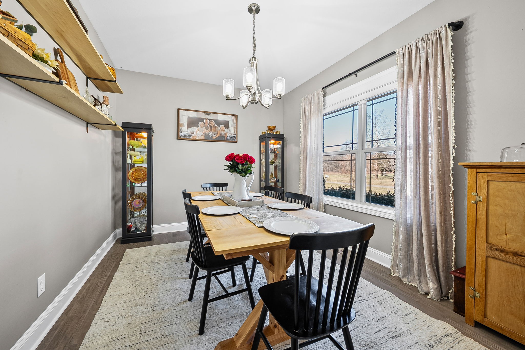 2810 Jim Taylor Road Woodlawn, TN 37191 - Photo 12 of 61 a view of a dining room with furniture window and wooden floor