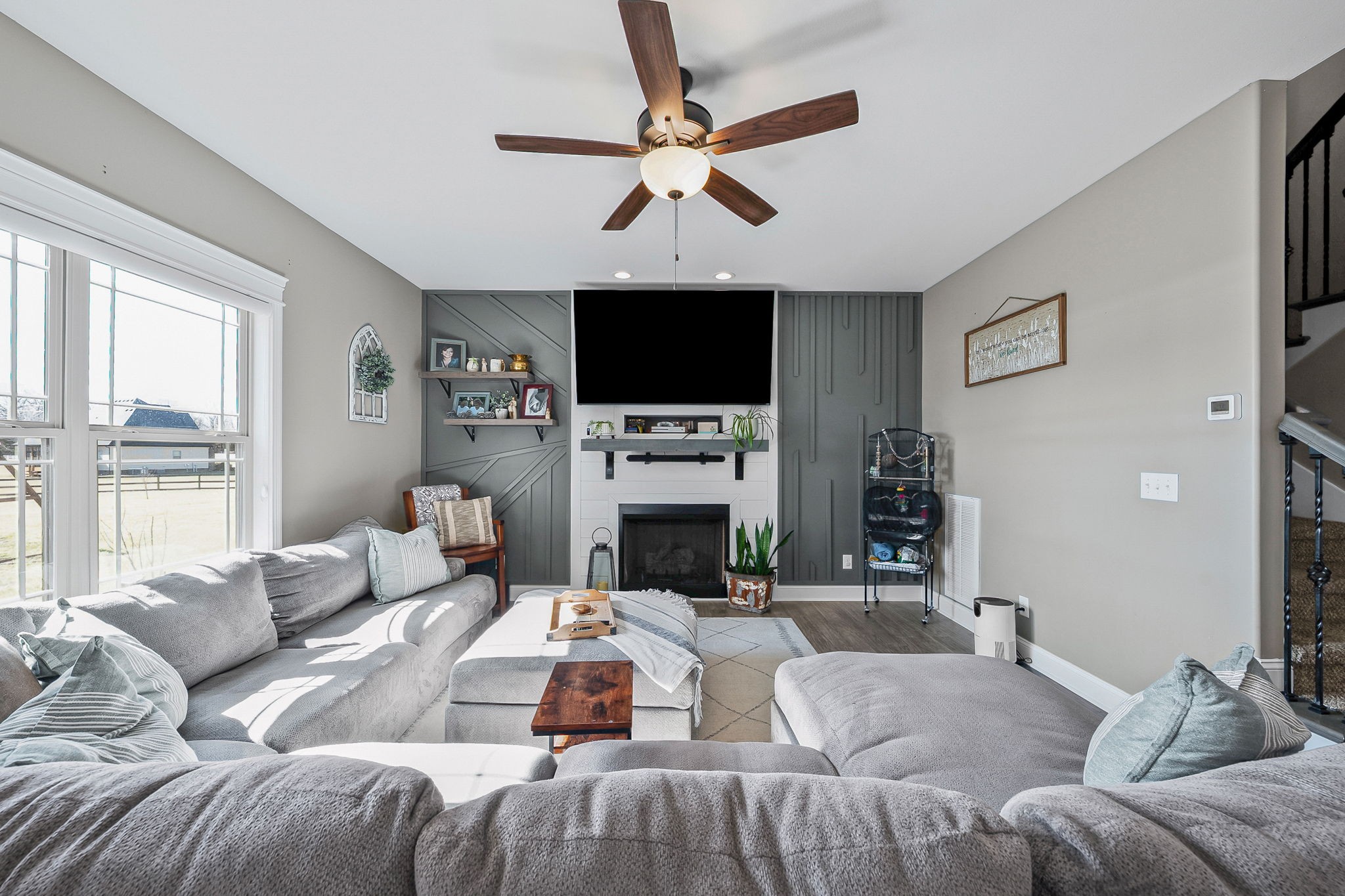 2810 Jim Taylor Road Woodlawn, TN 37191 - Photo 15 of 61 a living room with furniture a fireplace and a flat screen tv
