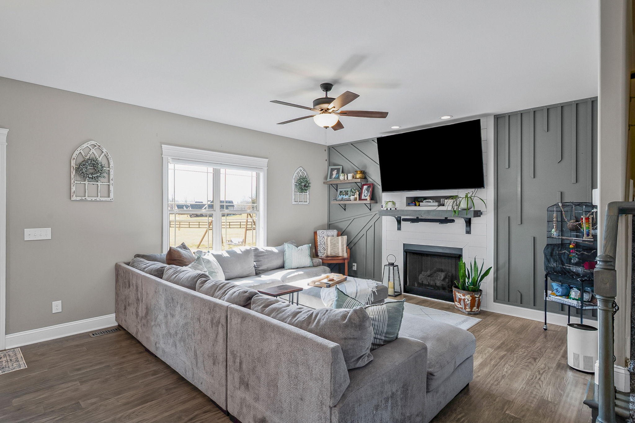 2810 Jim Taylor Road Woodlawn, TN 37191 - Photo 17 of 61 a living room with furniture a flat screen tv and a fireplace