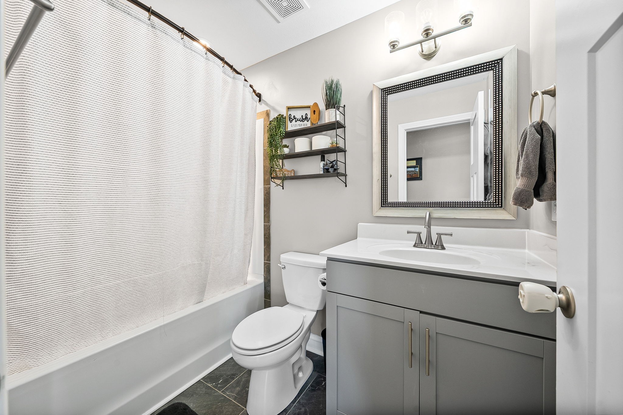 2810 Jim Taylor Road Woodlawn, TN 37191 - Photo 34 of 61 a bathroom with a toilet a sink and a mirror