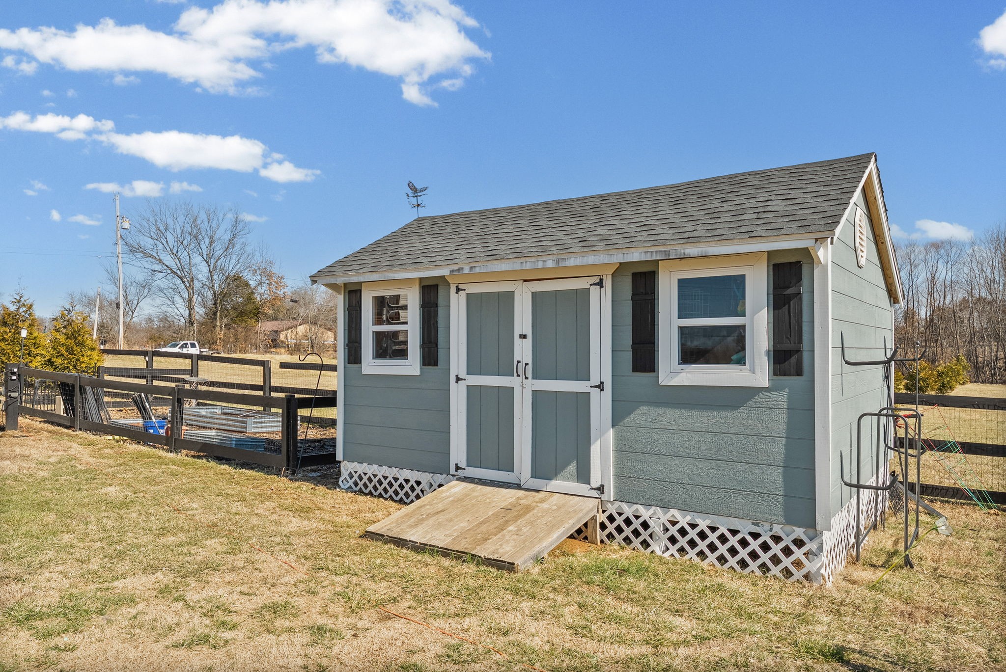 2810 Jim Taylor Road Woodlawn, TN 37191 - Photo 44 of 61 a view of a house with a wooden fence