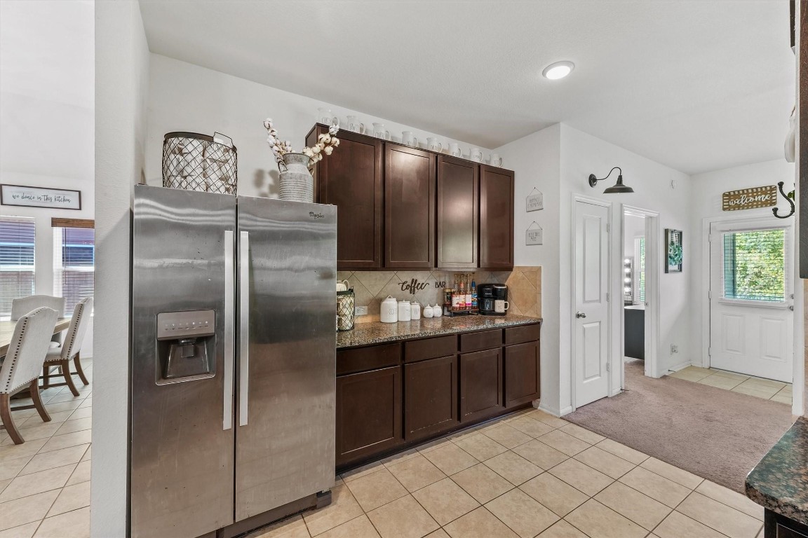 5303 Rivers Edge Drive Richmond, TX 77469 - Photo 11 of 26 a kitchen with stainless steel appliances granite countertop a refrigerator and a sink