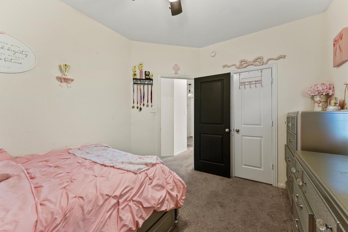 5303 Rivers Edge Drive Richmond, TX 77469 - Photo 16 of 26 a bedroom with a bed and a dresser