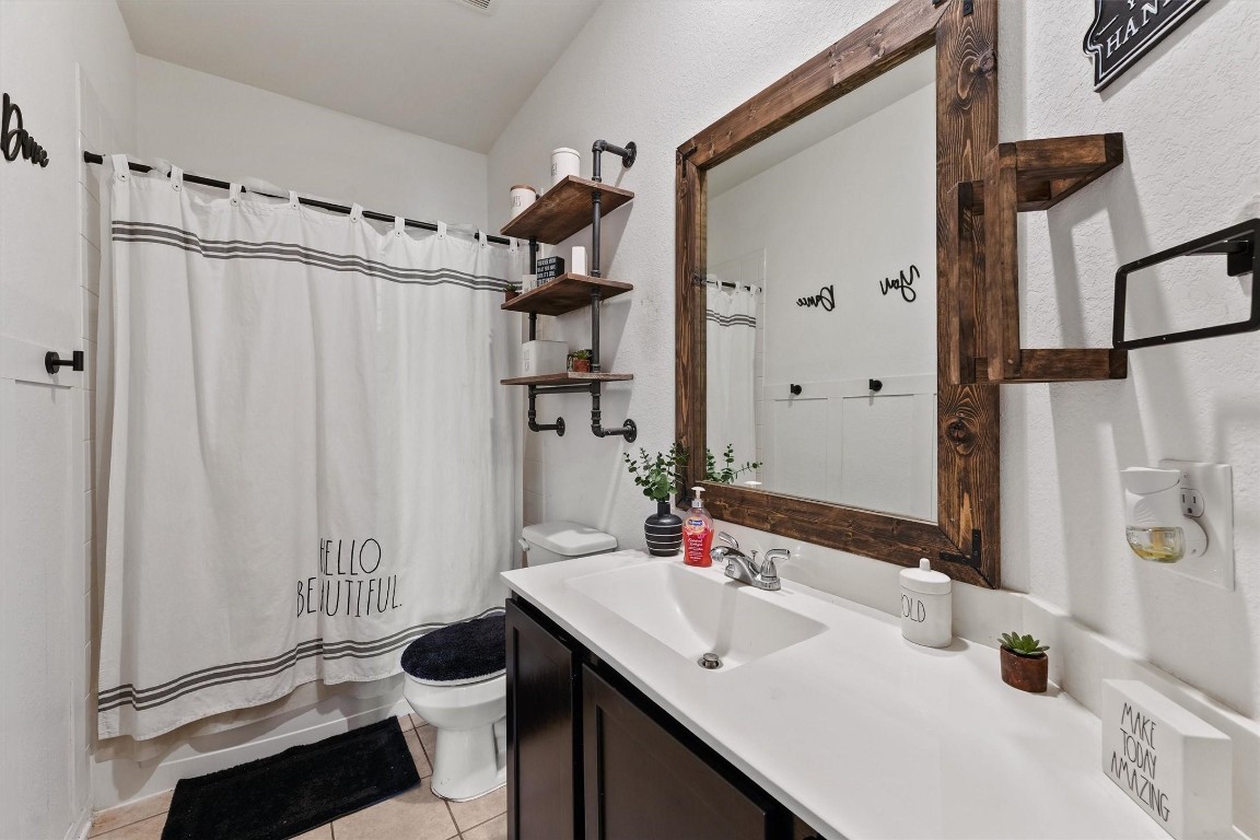 5303 Rivers Edge Drive Richmond, TX 77469 - Photo 17 of 26 a bathroom with a sink and a mirror