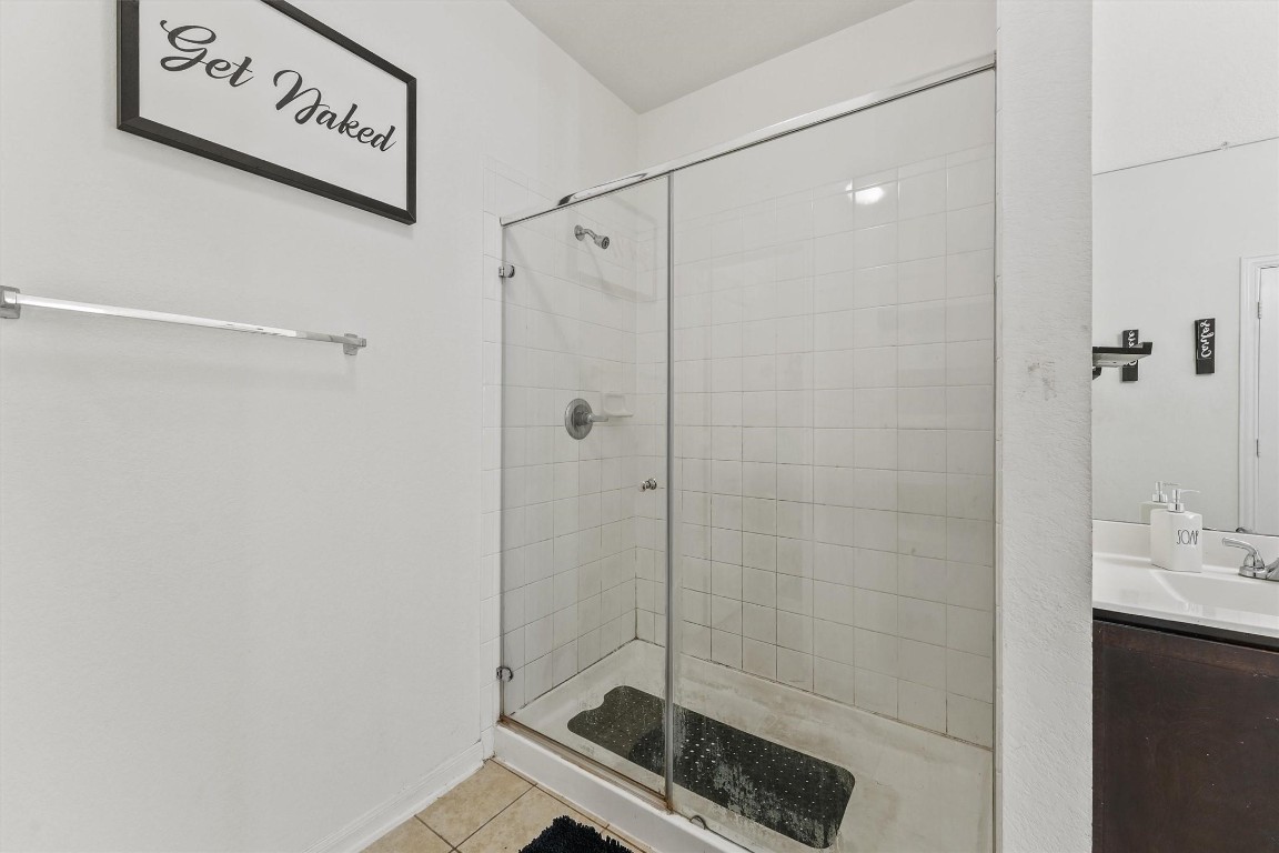 5303 Rivers Edge Drive Richmond, TX 77469 - Photo 21 of 26 a bathroom with a shower and a sink