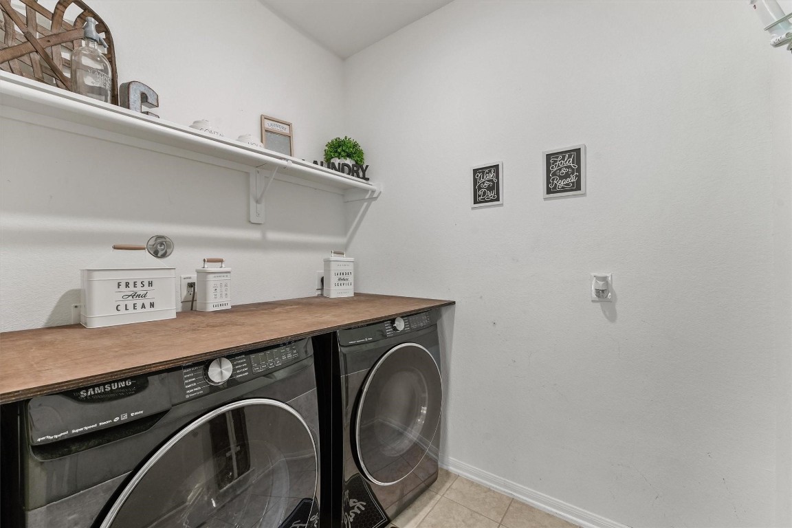 5303 Rivers Edge Drive Richmond, TX 77469 - Photo 22 of 26 a utility room with dryer and washer