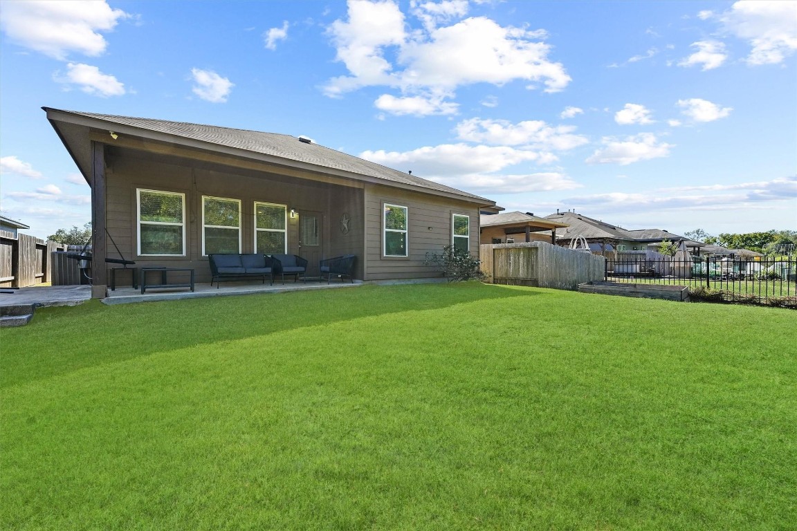 5303 Rivers Edge Drive Richmond, TX 77469 - Photo 25 of 26 a front view of house with yard and green space